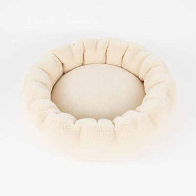 Cream plush donut dog bed